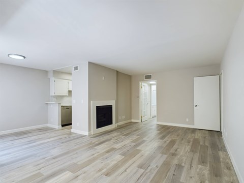 Apartments in Encino, CA - Living Room with Fireplace and Dining Room