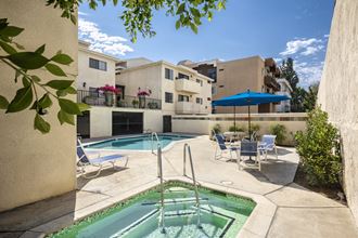 Apartments in Encino, CA - Pool and Patio with Jacuzzi plus Lounge Chairs and Tables with Umbrellas