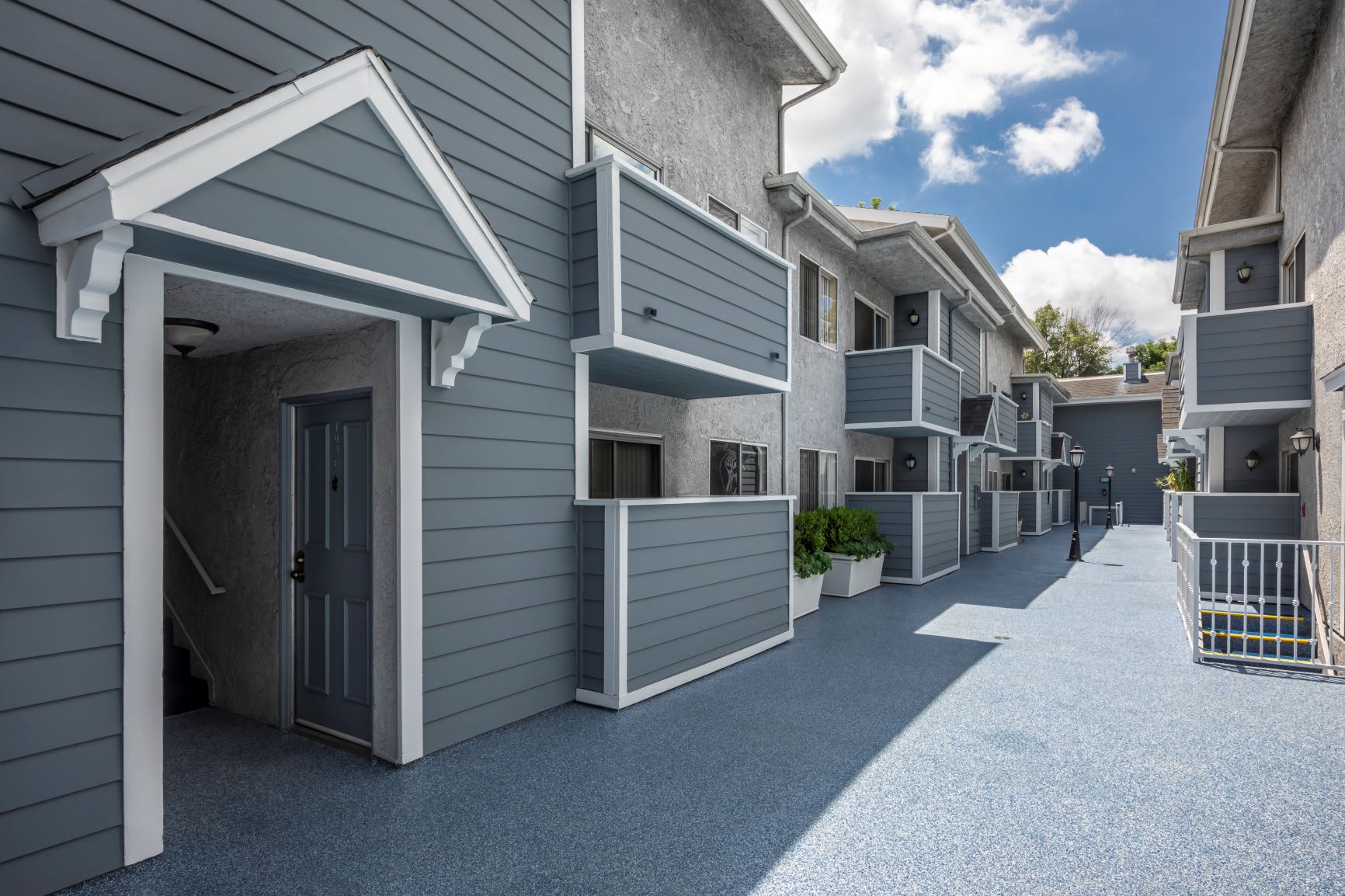 Apartments in Encino, CA - Walkway Between Apartment Buildings with Patios and Balconies