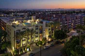 Apartments in Hollywood, CA - Elevated Night Time Lit Up View of Community with Rooftop Pool Area and Surrounding Areas summit - Photo Gallery 4
