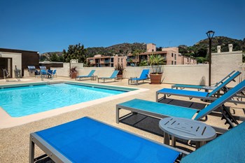 Apartments in Hollywood, CA - Pool, Patio iwth Lounge Chairs and Tables with view of  Grilling Area summit - Photo Gallery 6