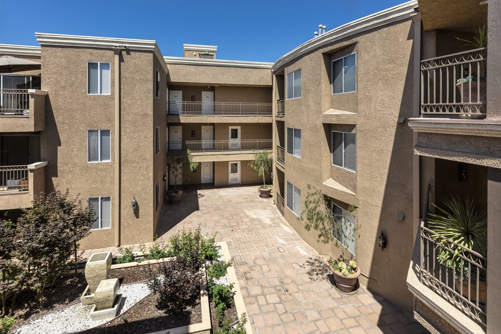Apartments in Sherman Oaks, CA - Balcony View of Courtyard and Surrounding Apartment Buildings