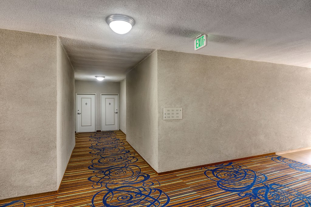 Apartments in Valley Village, CA - Hallway with Apartment Entrances