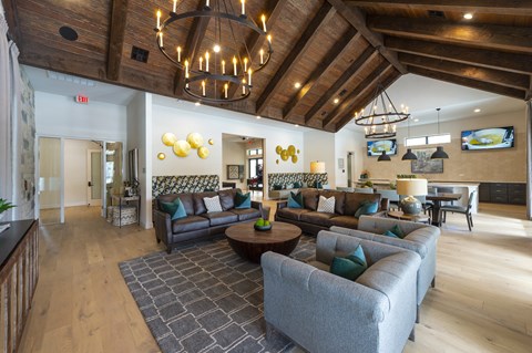 a large living room with couches and a table