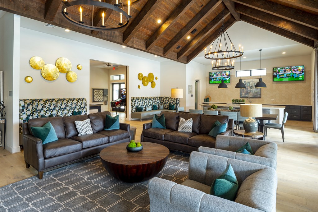 a living room with couches and chairs and a table