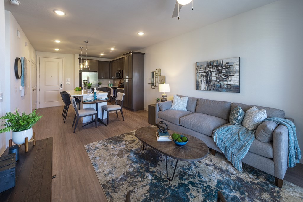a living room and dining room with a couch and a table