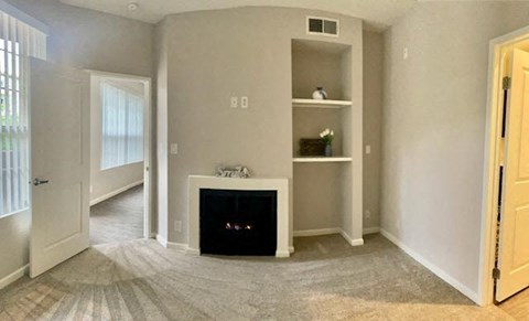 Apartments in Hollywood, CA - The Summit Livingroom with built-in bookshelves and fireplace