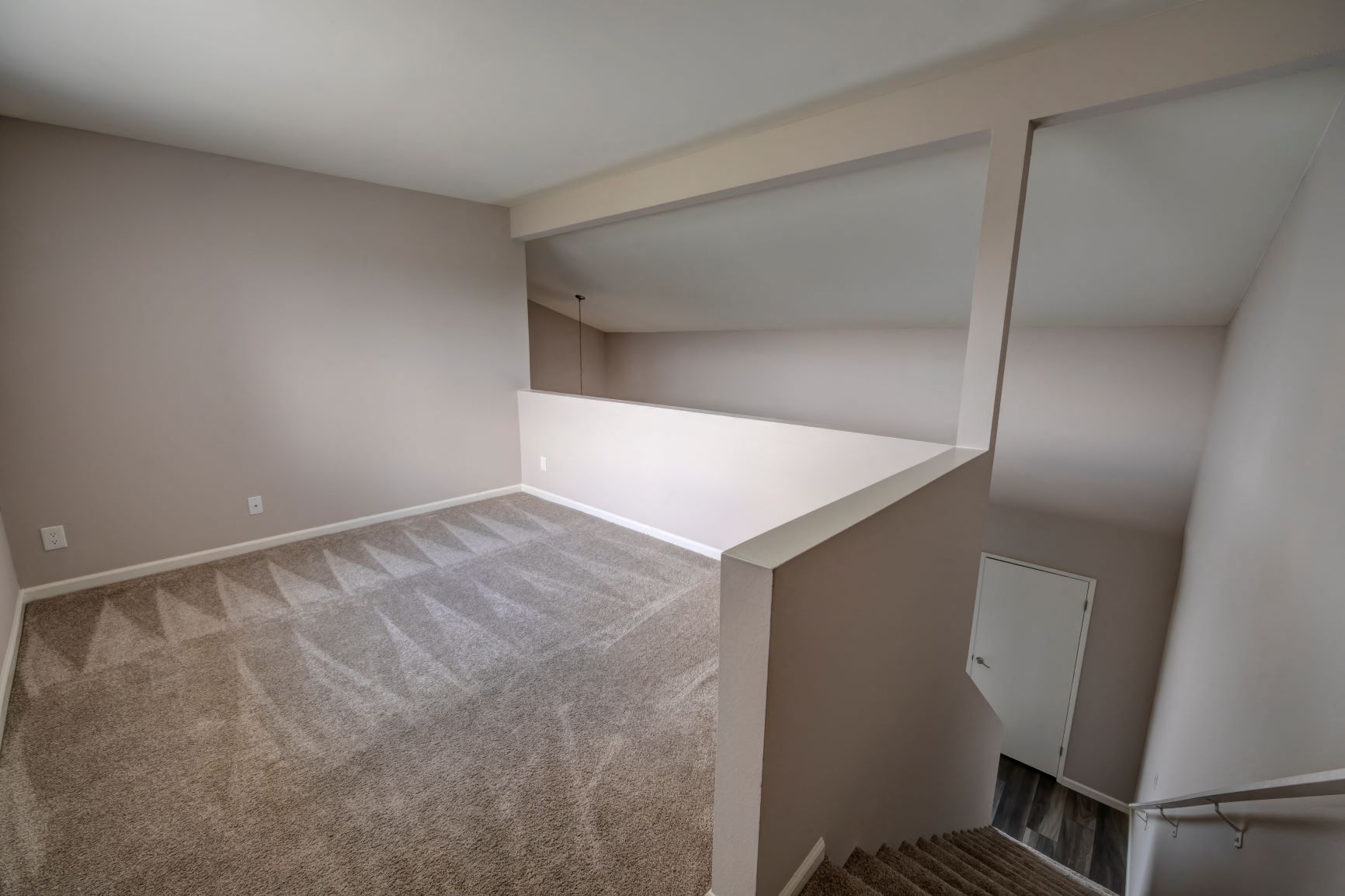 One Bedroom Apartments in Encino, CA  Apartment Loft, Stairs Going Down View of Entrance Door and Foyer