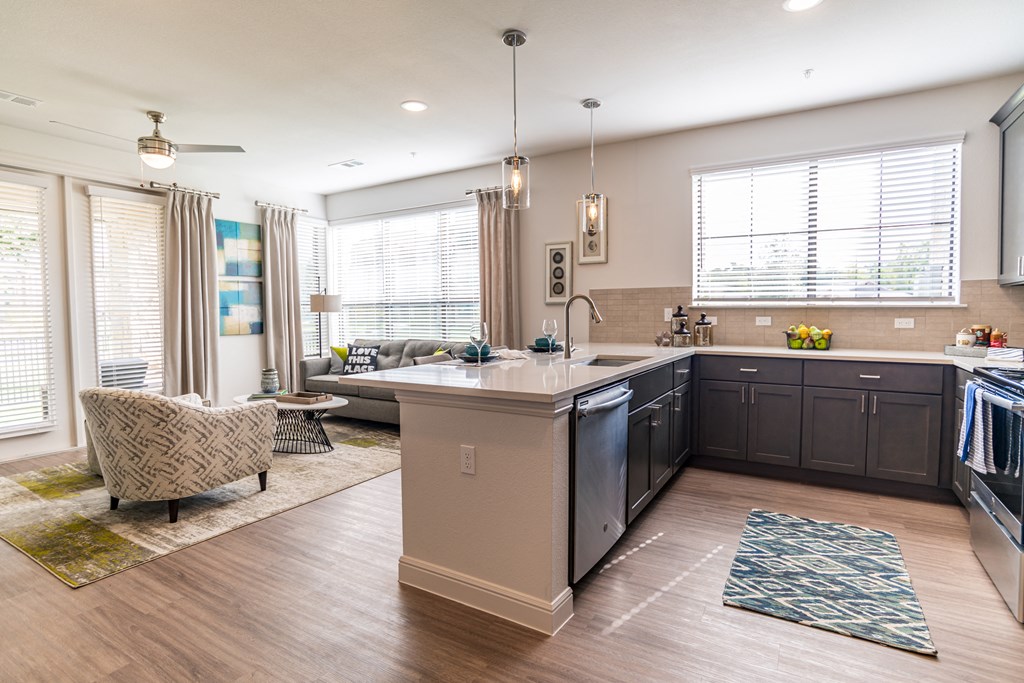 a kitchen and living room in a new home
