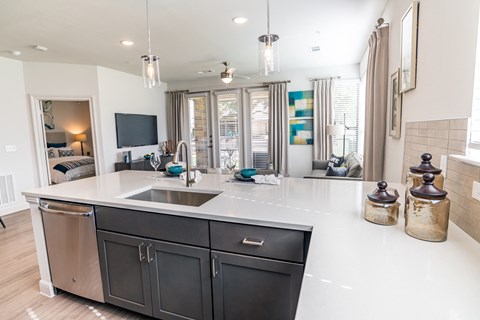 a kitchen with a large counter top and a sink