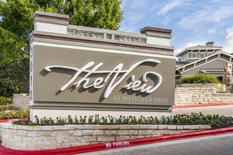 The entrance to The View at Westover Hills with a sign and a red no parking strip.