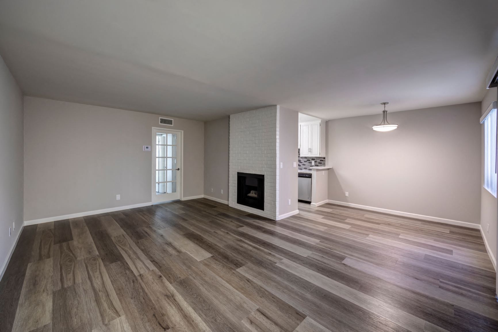 Two Bedroom Apartment in Encino, CA - Apartment Living Room with Fireplace, Dining Room, Kitchen