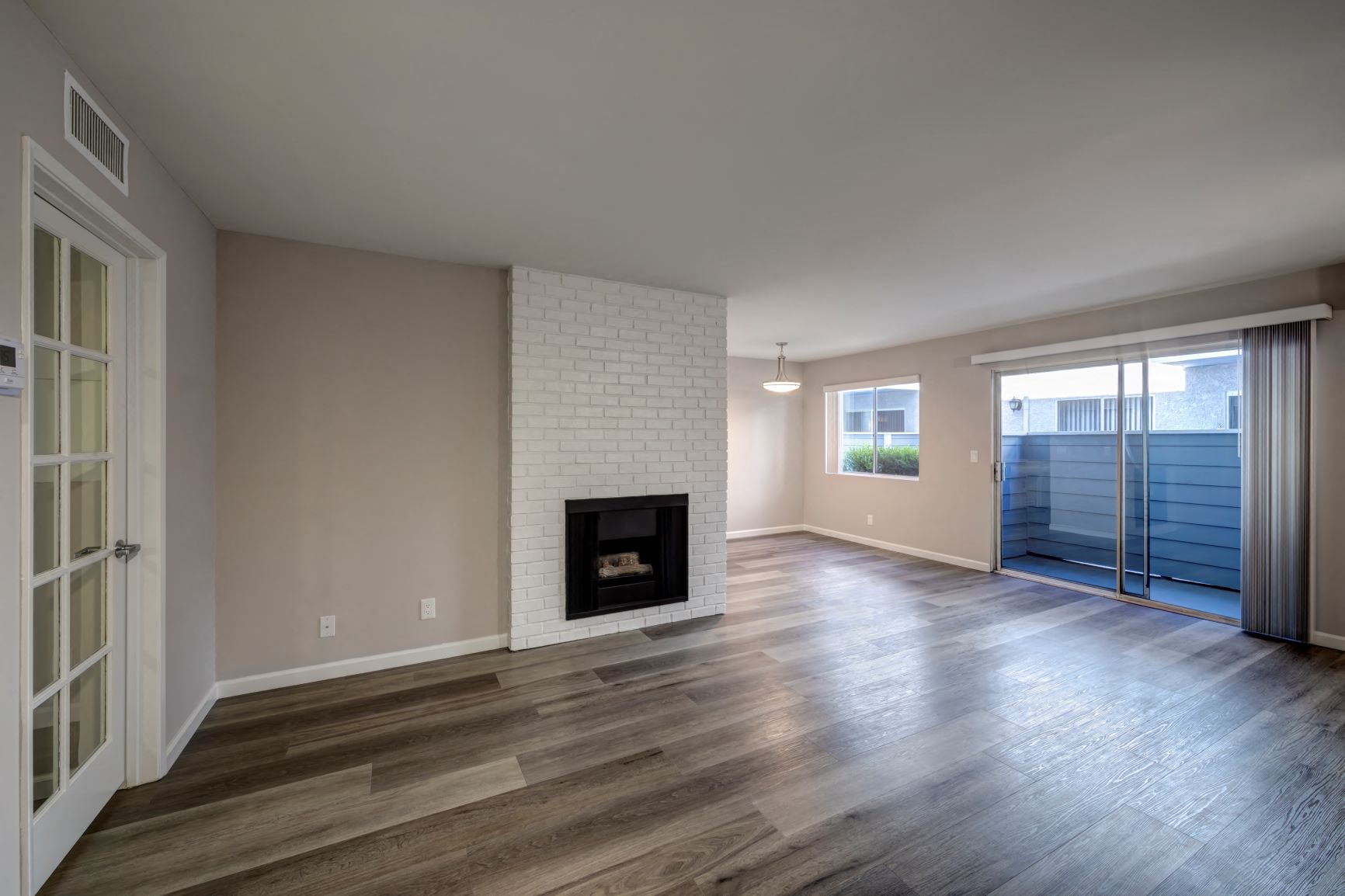 Two Bedroom Apartments in Encino, CA  Apt Living Room with Fireplace, Dining Room, Slider to Privacy Balcony