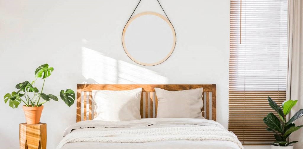 a bedroom with a bed and a mirror on the wall at Greenway Village Apartments, Metuchen, NJ, 08840