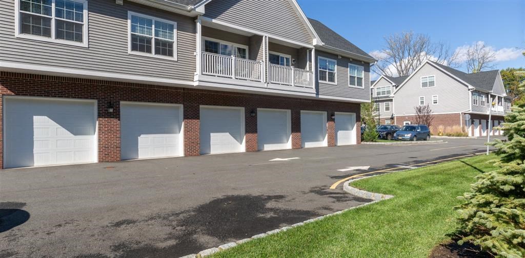a row of houses with white garage doors at Zephyr Ridge Apartment Homes, Cedar Grove, NJ, 07009