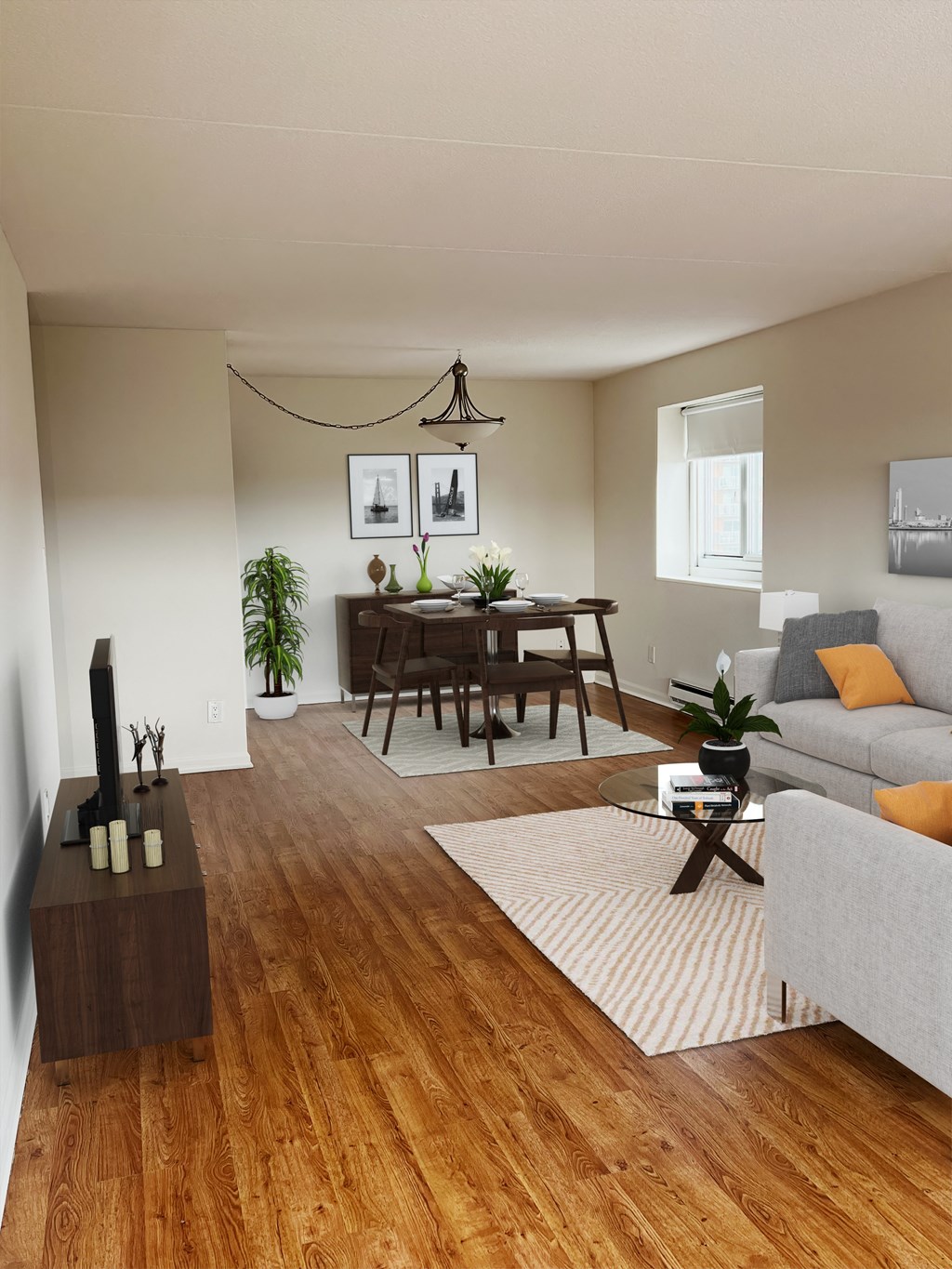 a living and dining room with hardwood floors and a chandelier at The Ivanhoe Apartments, New Jersey, 07601