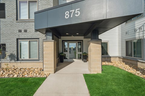 The front of a building with the number 875 on it.