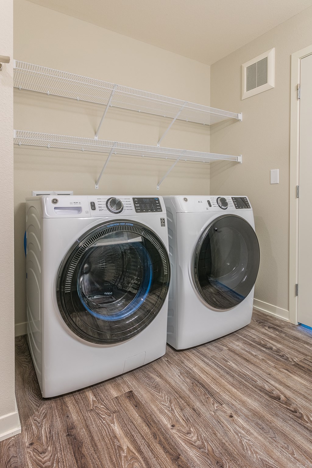 redesigned laundry room with washer and dryer at the preserve at great neck apartments