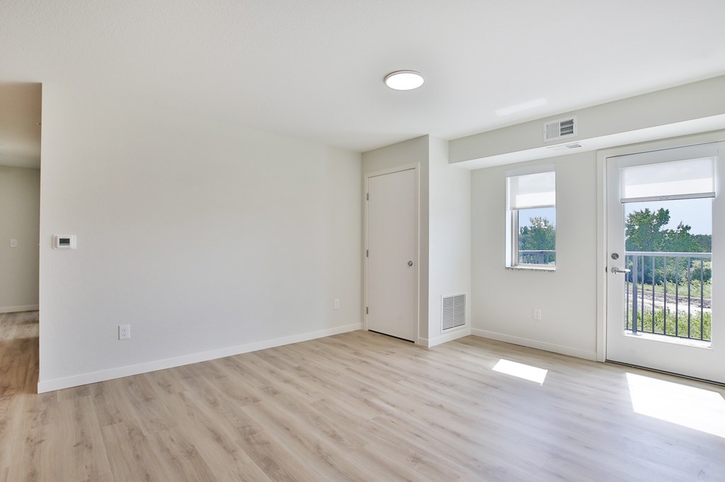 A room with a slanted ceiling and a window.