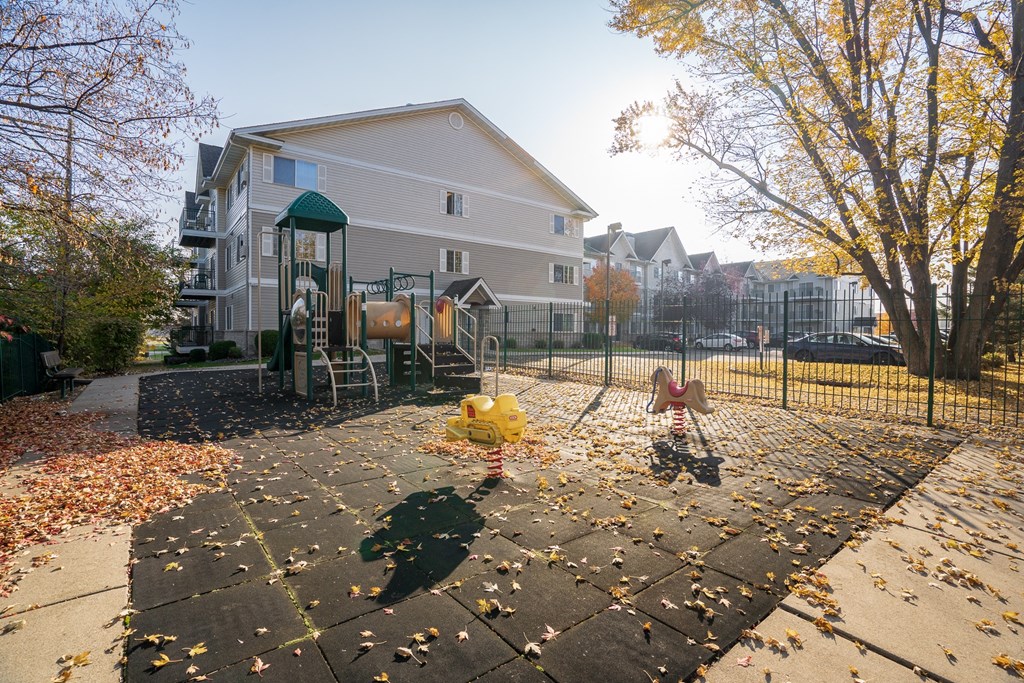a childrens playground in a yard in front of a house