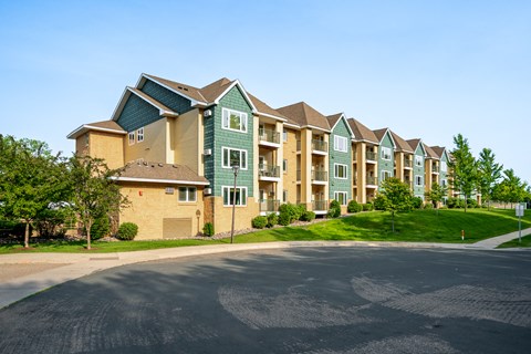Apartment complex with a road in front.