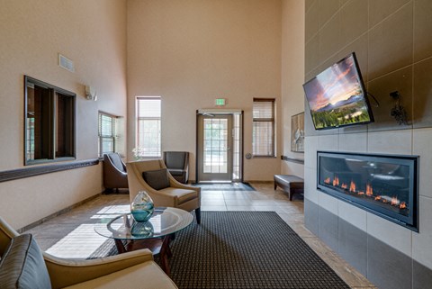 a living room with couches and a fireplace