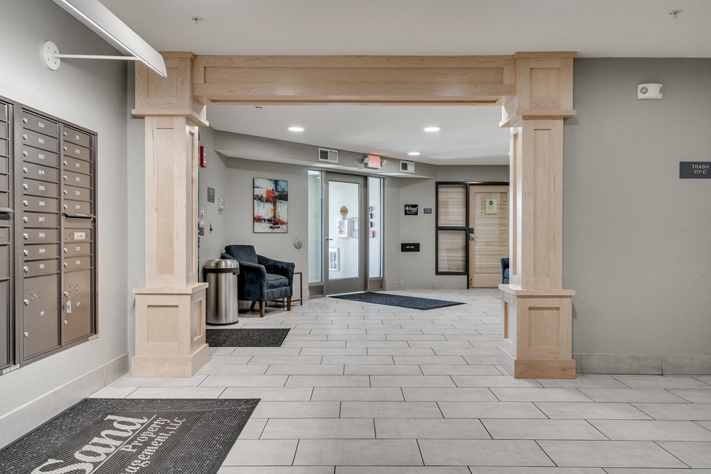 the lobbies of the residences at the preserve feature wood columns and a lobby area