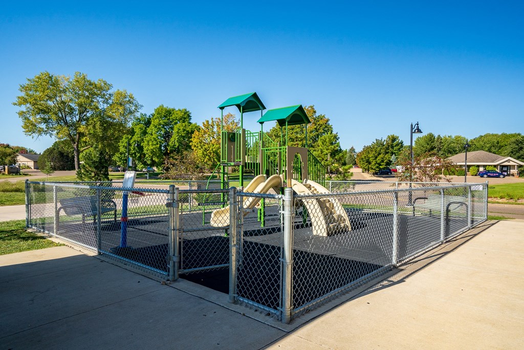 a playground with a slide at a park