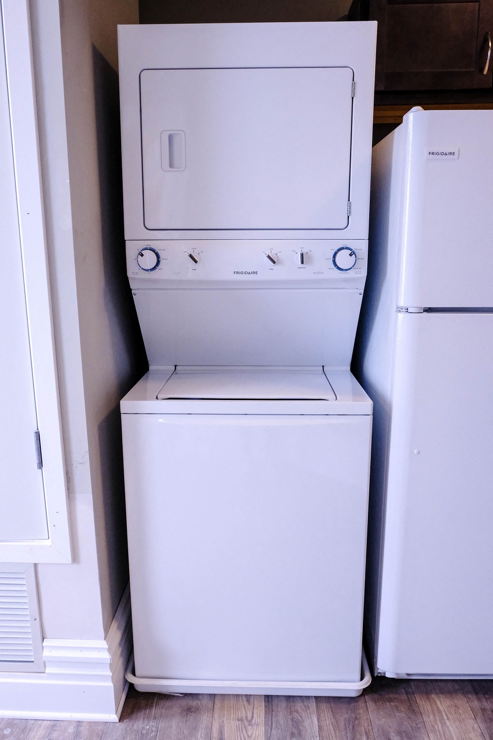 A white stacked washer and dryer.