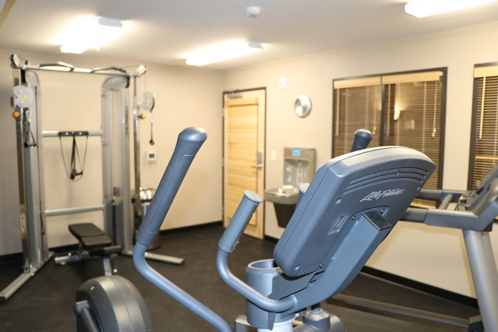 a gym with a lot of equipment in it