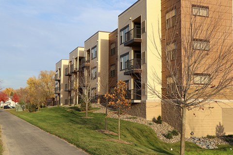 an apartment building on the side of a road