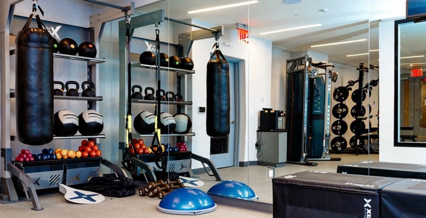Fitness Center With Modern Equipment Fitness Center With Modern Equipment at 470 Manhattan, Brooklyn, New York - Photo Gallery