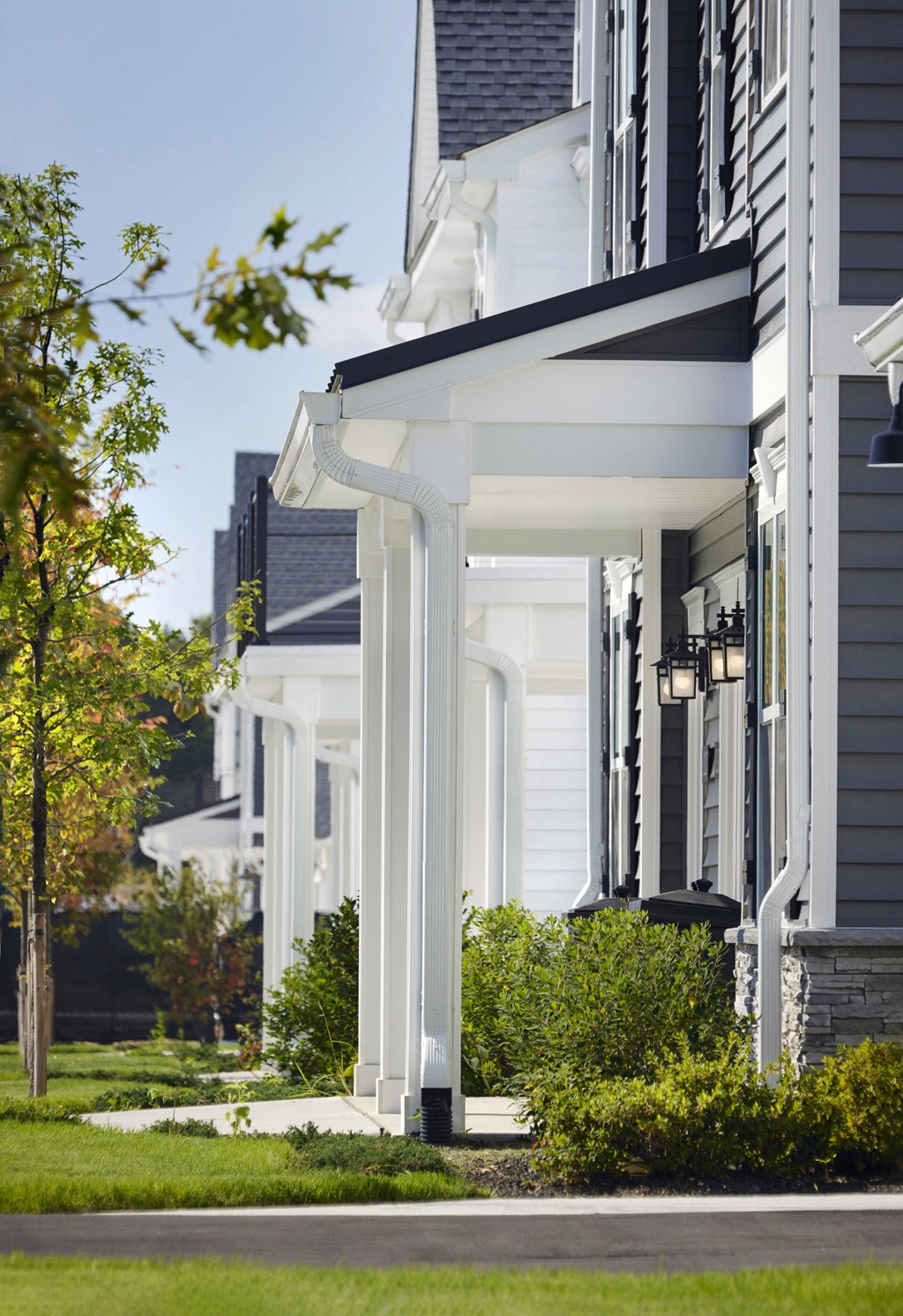a row of white columns on the side of a house