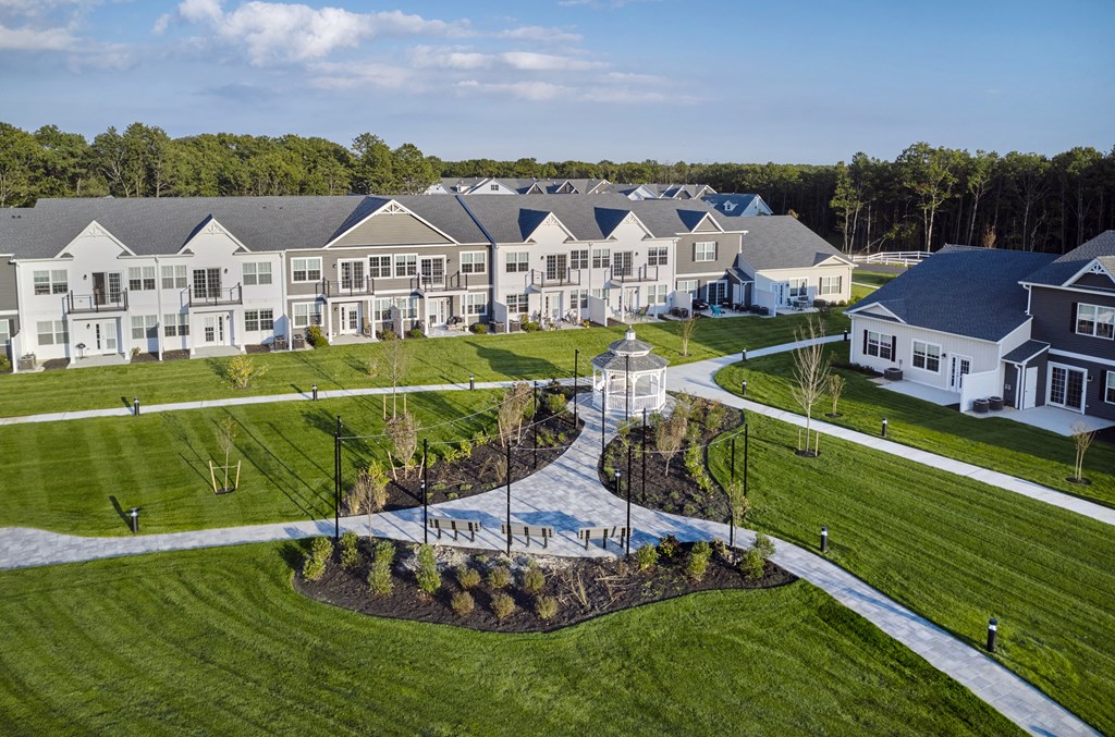 an aerial view of a neighborhood with houses and a fountain