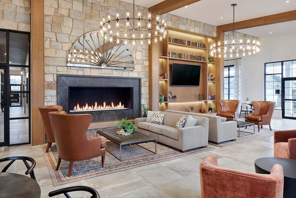a living room filled with furniture and a fireplace