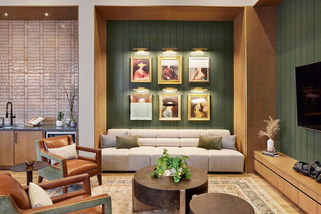 a living room filled with furniture and a flat screen tv