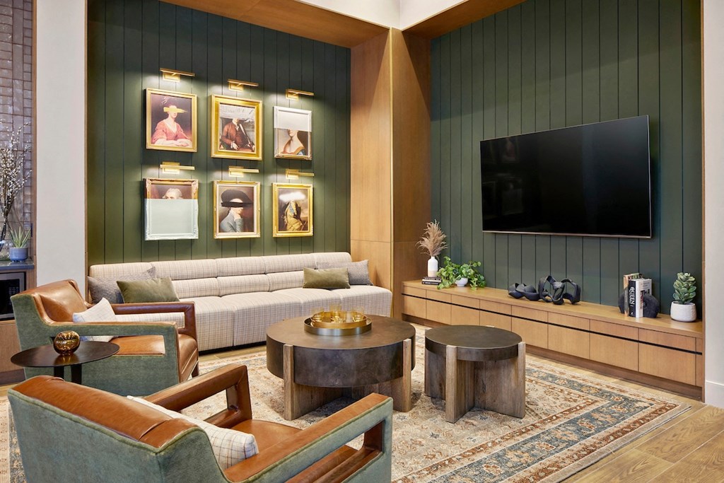 a living room filled with furniture and a flat screen tv