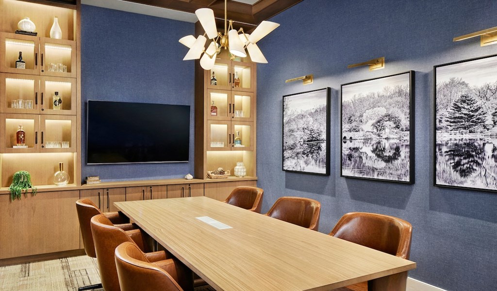 a conference room with a table and chairs