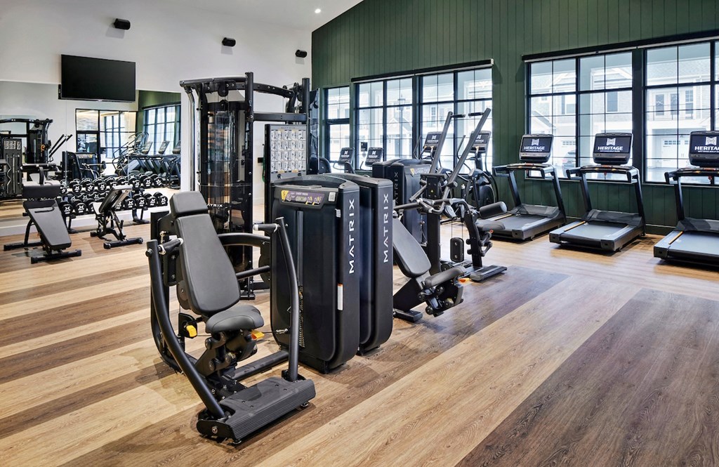 a gym with cardio machines and other exercise equipment