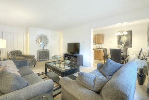 Open concept living room and dining area at Chili Heights Apartments, New York