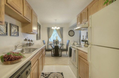 Kitchen with dining nook and large window at Chili Heights Apartments, Rochester, New York