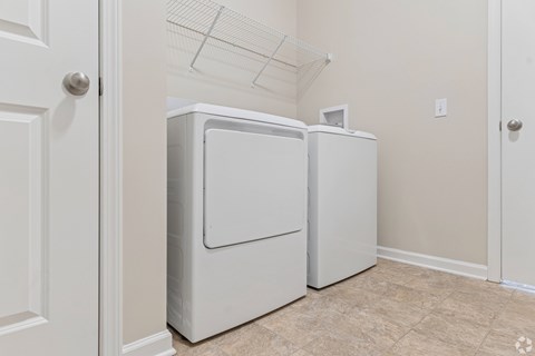 A white refrigerator and freezer in a kitchen.