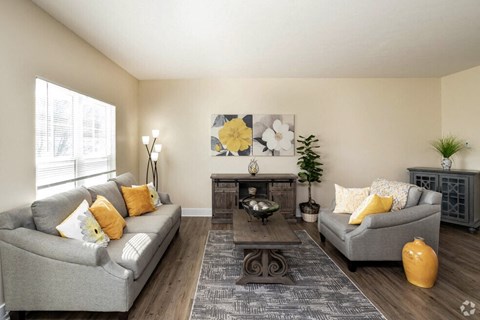 a living room with couches and a table