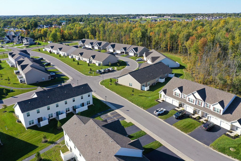 a group of houses in a neighborhood with trees
