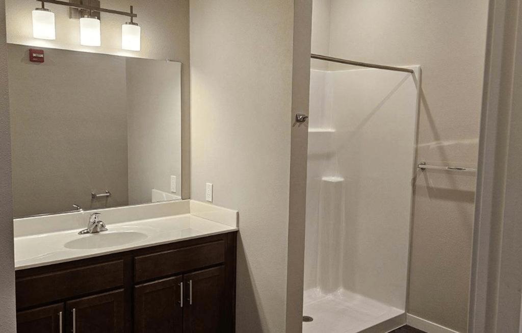 a bathroom with a sink and a shower