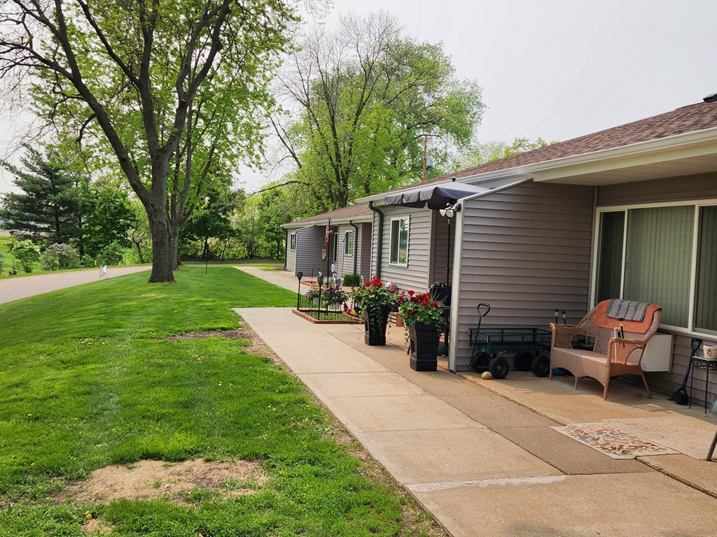 a house with a porch and a lawn