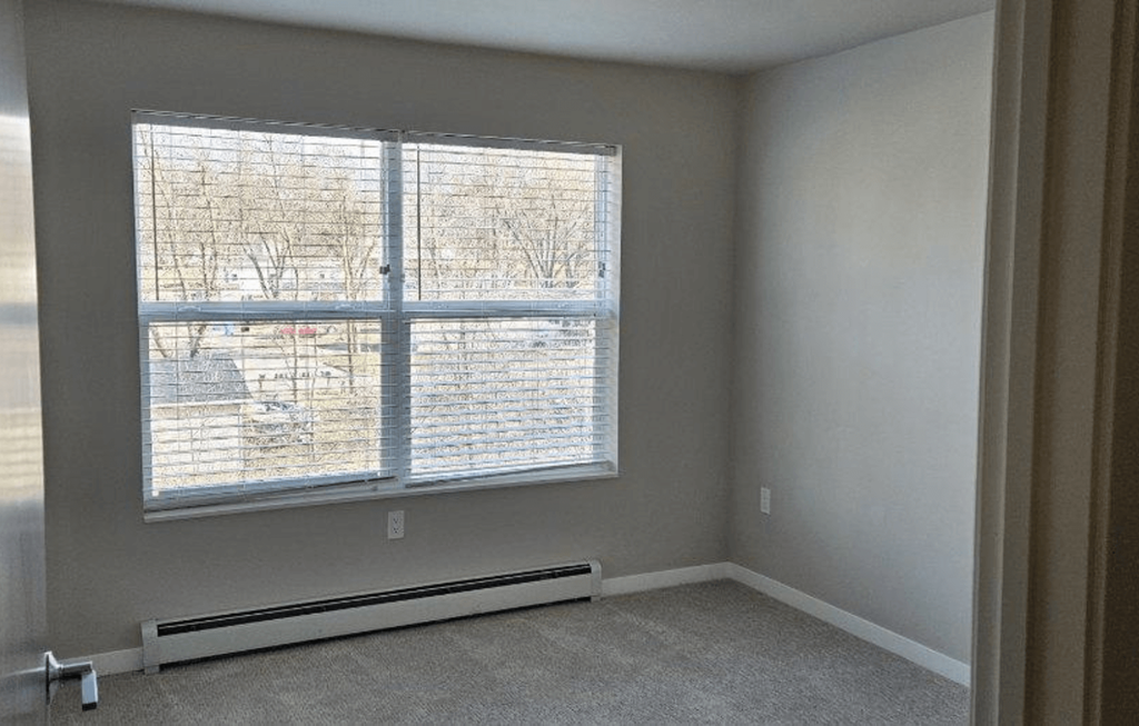 an empty room with a large window