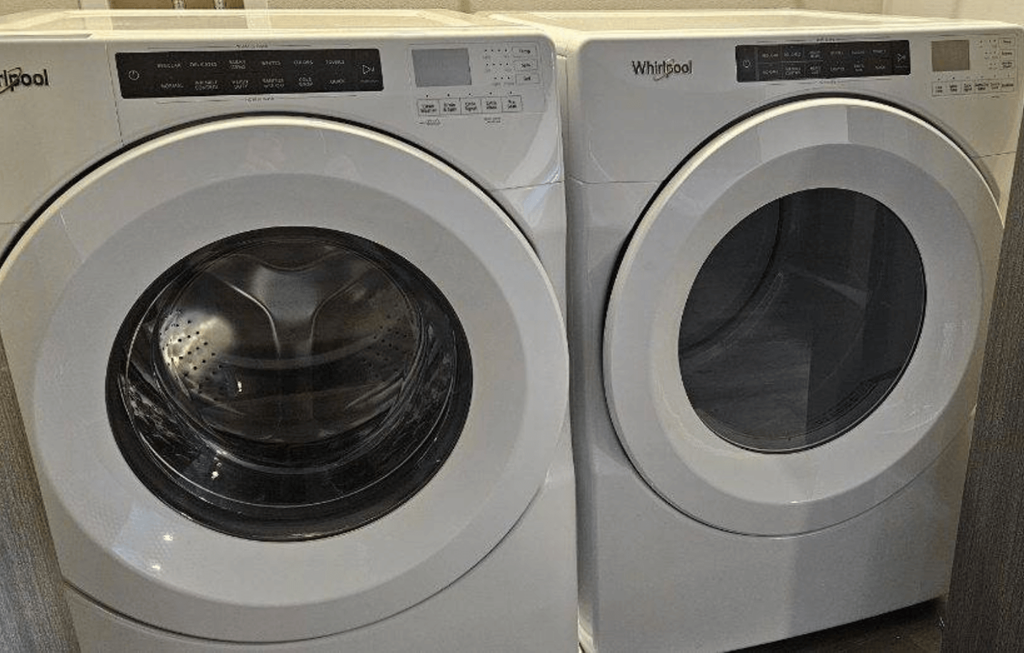 two white washing machines next to each other