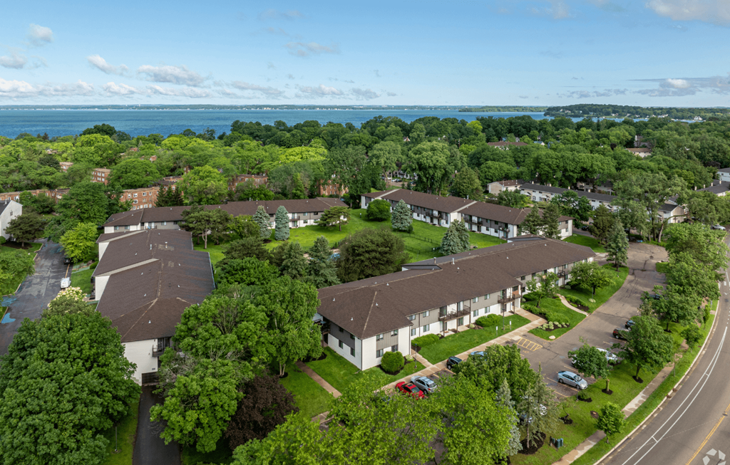 A bird's eye view of a residential area with houses and trees.
