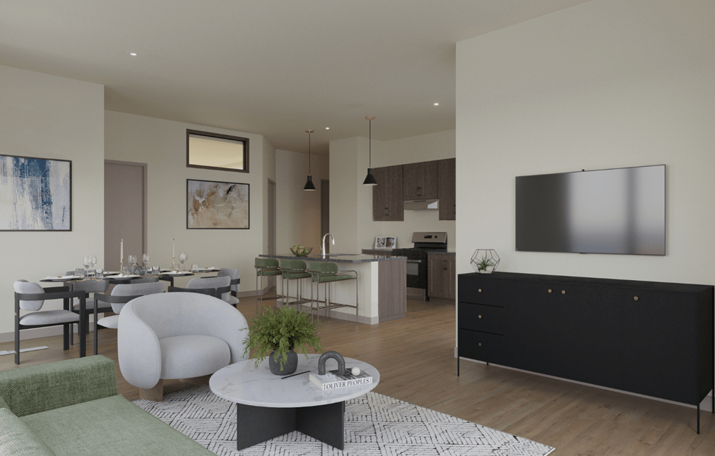 A modern living room with a grey sofa and a coffee table.